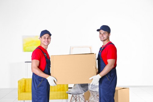 Furniture pick-up service in Pimlico removing a sofa from a flat