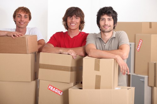 Efficient moving service preparing furniture for transport in Pimlico