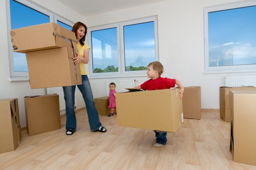Professional movers navigating difficult access in a Pimlico flat move