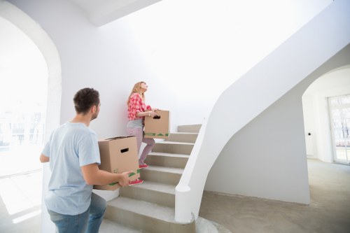 Removal crew managing furniture during a house move